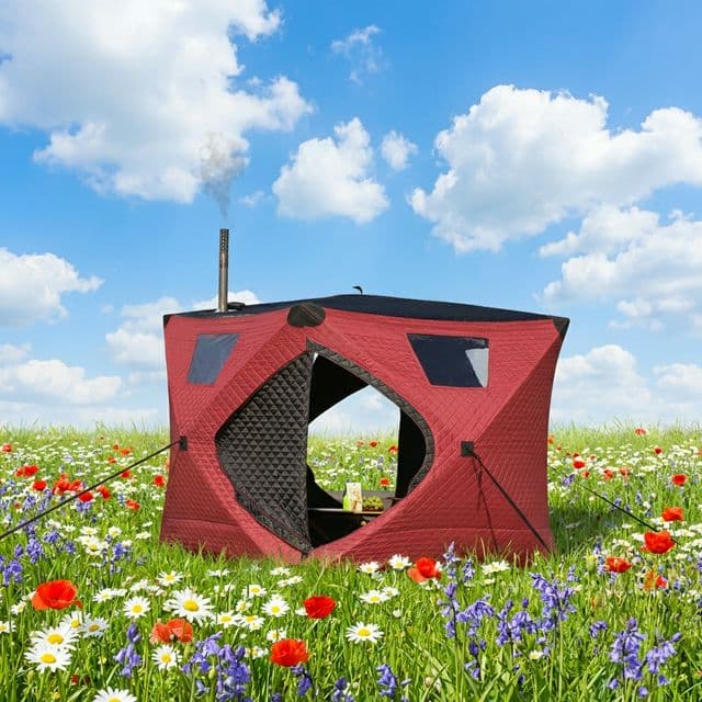 Tent sauna surrounded by spring wildflowers