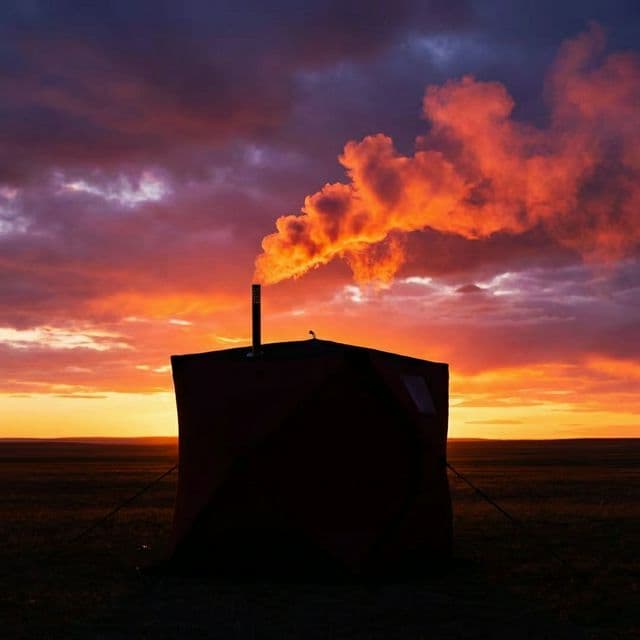 Tent sauna sunset silhouette