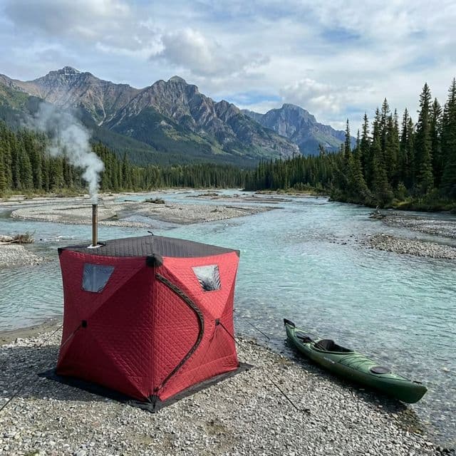 Tent sauna by wilderness river